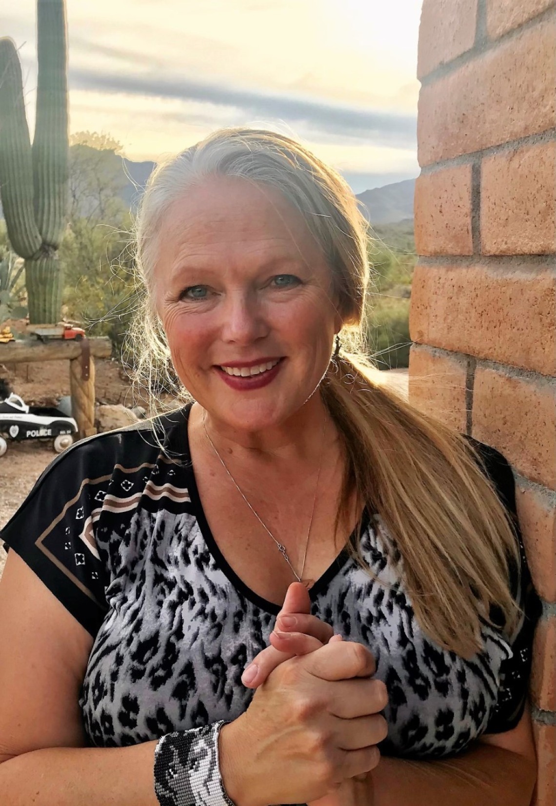 Photo of Dr. Laura M. Norman with a saguaro in background