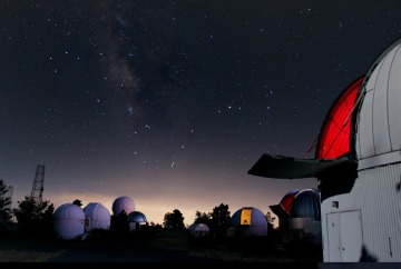 Night view of telescope domes on Mt. Lemmon